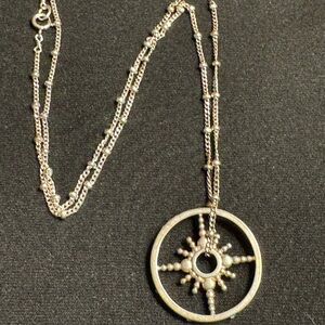 Radiant Silver Starburst Necklace